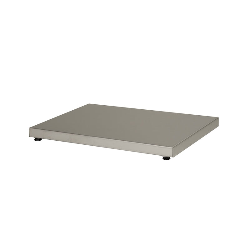 A stainless steel panel with adjustable feet used to protect sauna floors from wood-burning and electrical sauna heater heat.