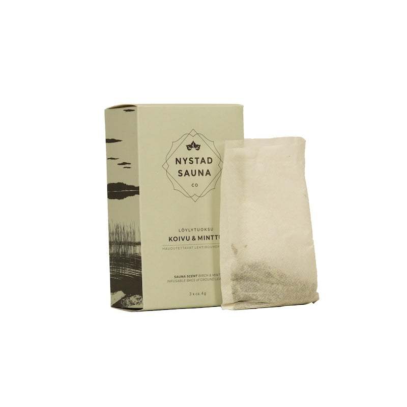 A box and bag of dried birch and mint leaves used to infuse sauna water with essential oils and essence for aroma.