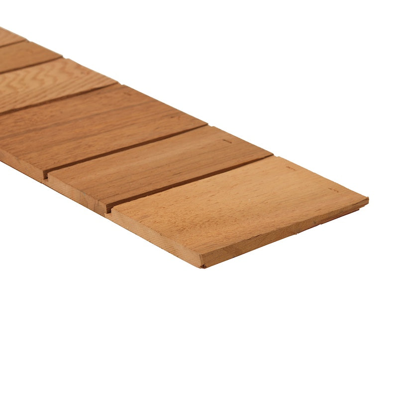 A pre-fabricated plank of western red cedar shingles or shakes used for sauna siding.