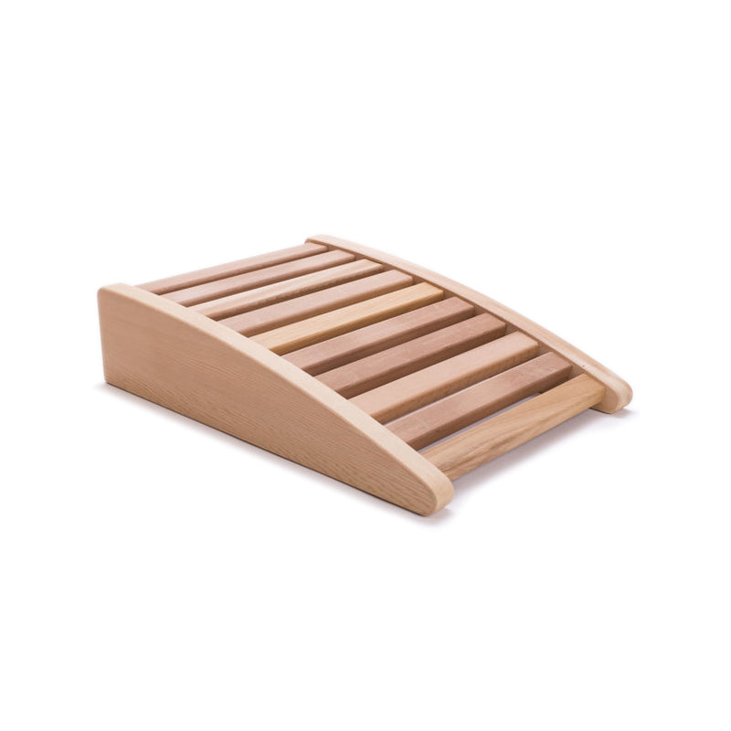 A slatted cedar back rest with an ergonomic curve to it used in saunas.