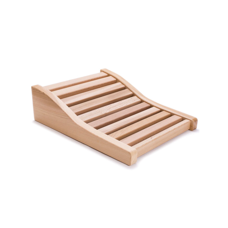 A slatted cedar back rest with an ergonomic curve to it used in saunas.