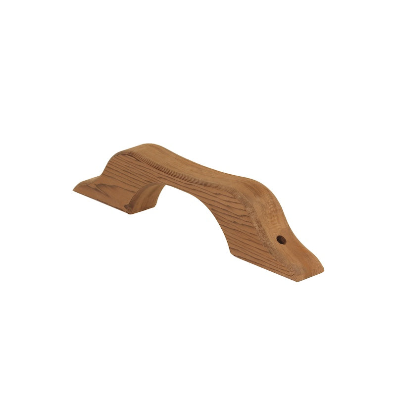 A small cedar sauna door handle.
