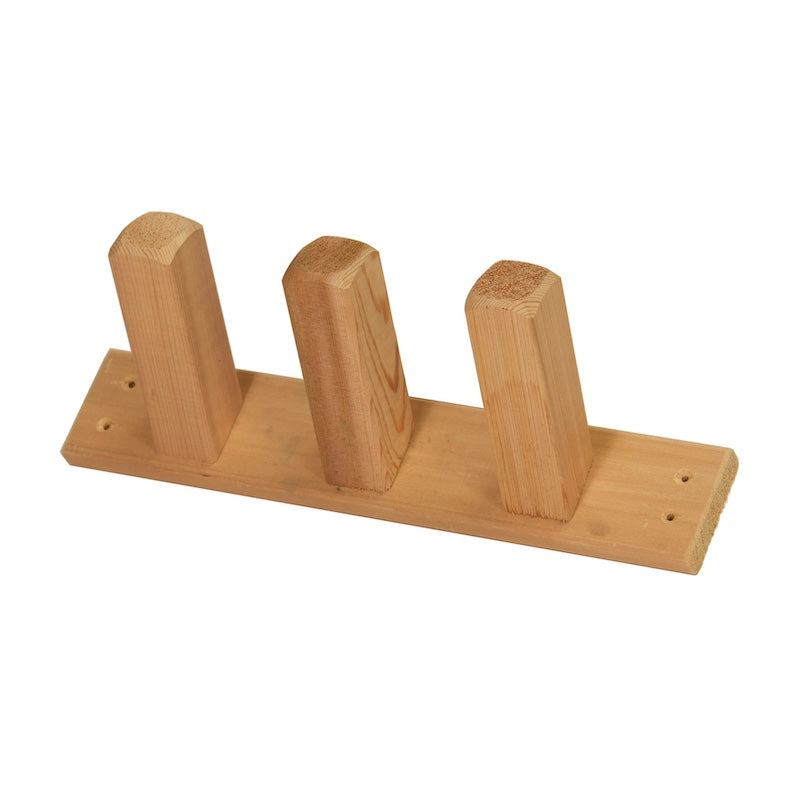 A cedar towel and robe hook with three pegs used in saunas.