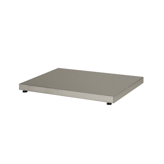 A stainless steel panel with adjustable feet used to protect sauna floors from wood-burning and electrical sauna heater heat. 