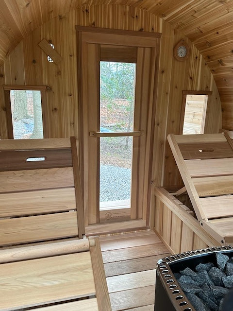 Lounge benches inside of a Henki Custom Barrel Sauna.