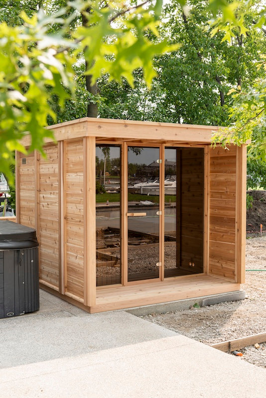 A Custom Pure Cube Sauna next to a hot tub in Vancouver.