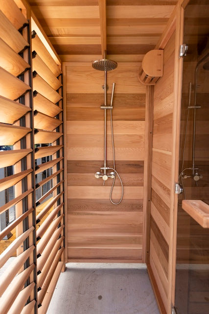 The outdoor shower of a Custom Pure Cube Sauna.