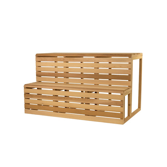 A pre-fabricated, slatted cedar bench with two levels for a sauna. 