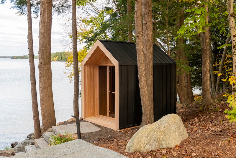 A Pure Cube Hudson Sauna next to a lake in Muskoka, Ontario.