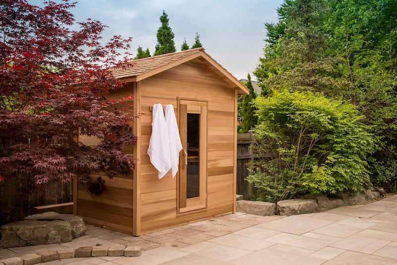 A Henki Modern Cabin Sauna in a backyard near Toronto, Ontario.