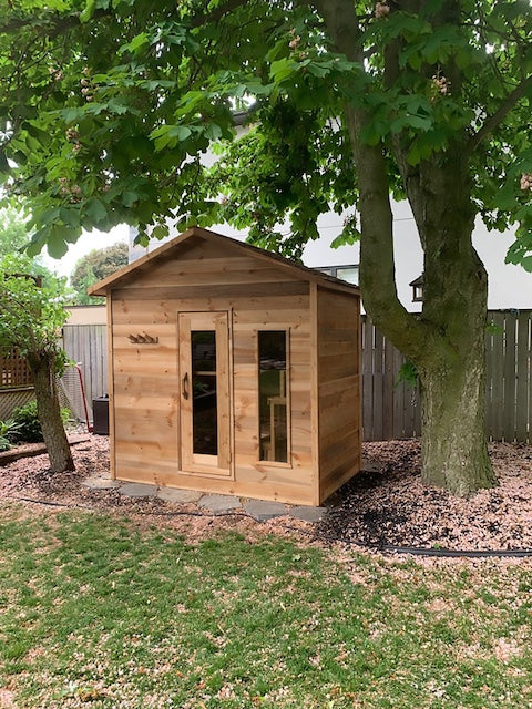 The front of a Modern Cabin outdoor sauna in a Toronto yard.