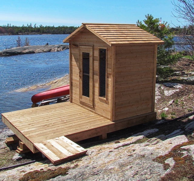 Henki's Modern Cabin Sauna on a deck in Georgian Bay next to the lake.