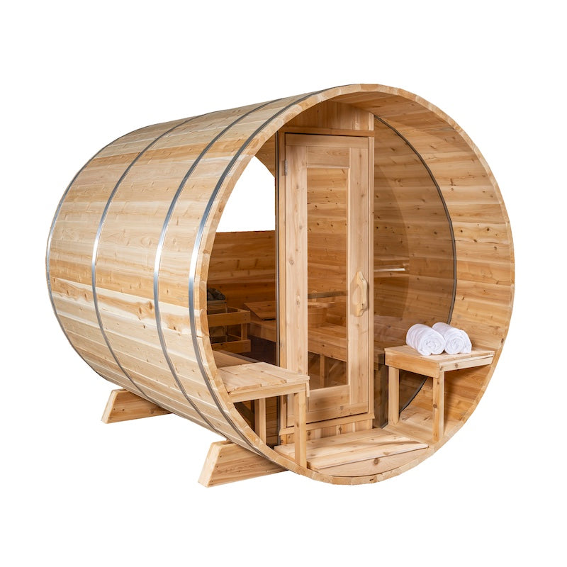 A modern, outdoor, cedar barrel sauna with three large glass windows, a glass door, and a porch.