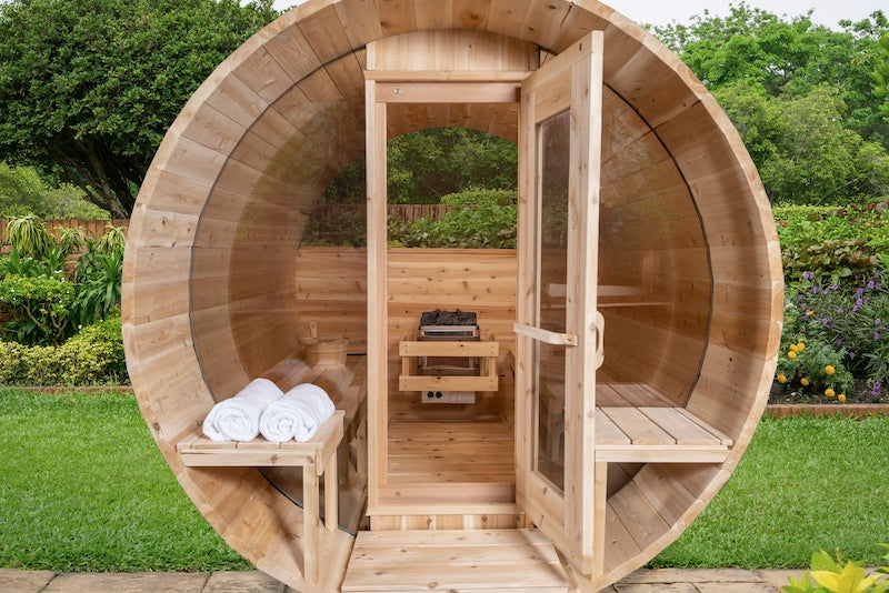 The front of a Henki Panoramic Barrel Sauna with the door open.