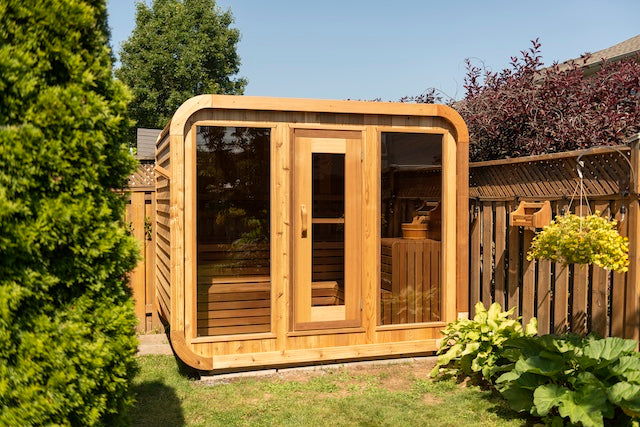A Henki Panoramic Cube Sauna tucked away in a Toronto backyard.
