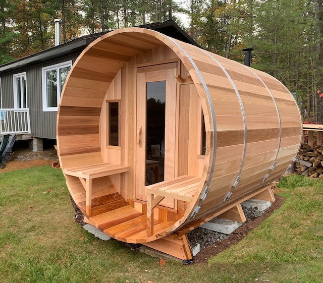 A Henki Window Barrel Sauna made of clear red cedar.